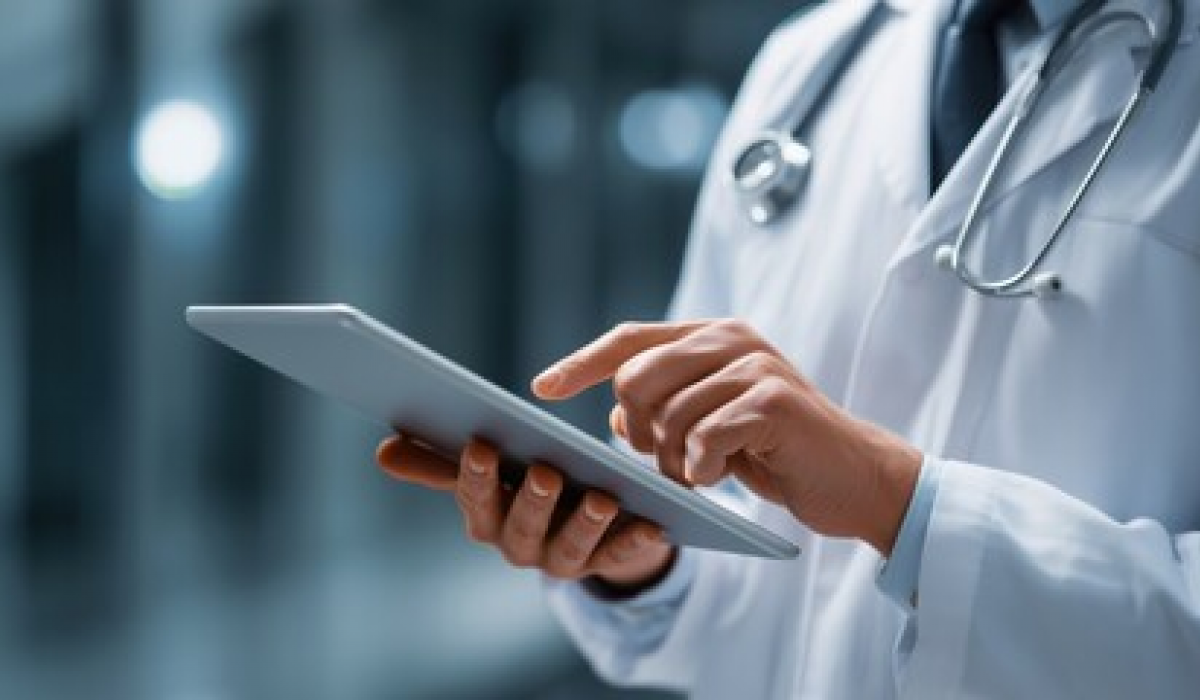 Physician reviewing medical compliance documentation on tablet