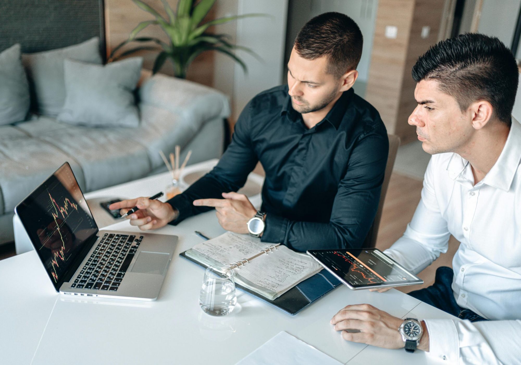 Healthcare compliance consultant and client reviewing vendor contract terms during a negotiation